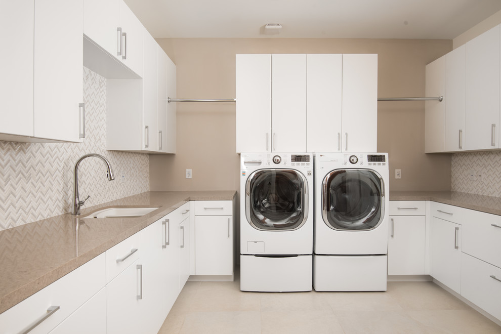 Design ideas for a medium sized u-shaped separated utility room in Phoenix with a submerged sink, flat-panel cabinets, white cabinets, composite countertops, beige walls, porcelain flooring, a side by side washer and dryer and beige floors.