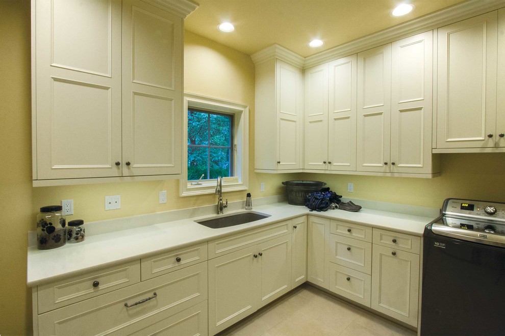 Large elegant laundry room photo in Seattle with recessed-panel cabinets and white cabinets
