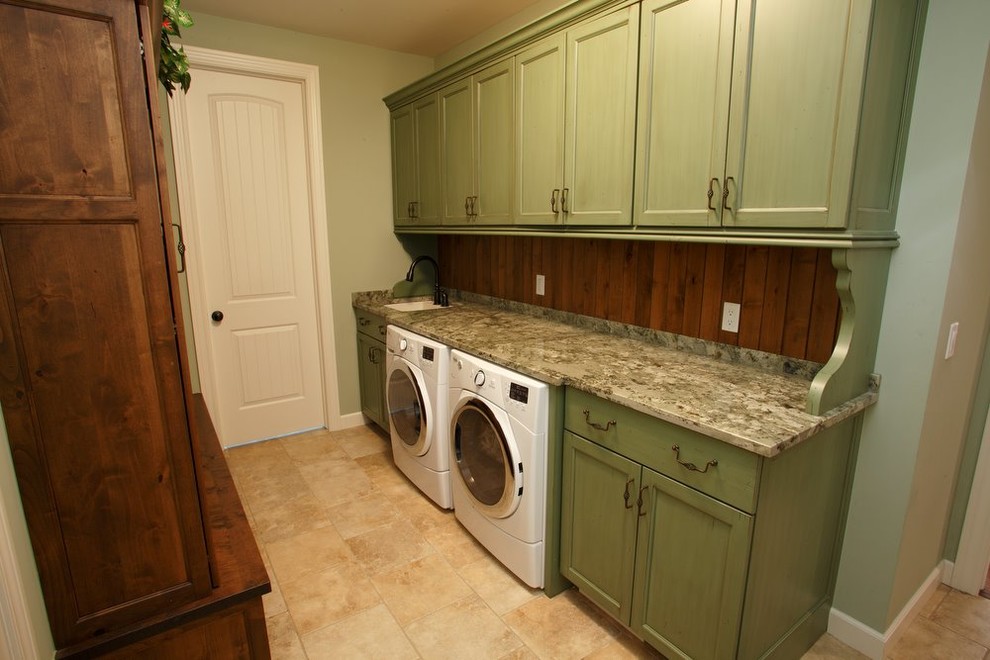 Mid-sized mountain style galley limestone floor dedicated laundry room photo in Detroit with a single-bowl sink, shaker cabinets, green cabinets, granite countertops, green walls and a side-by-side washer/dryer