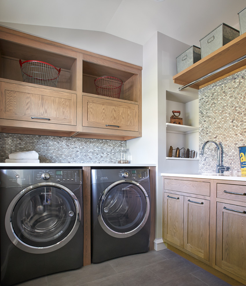 Medium sized rustic utility room in New York with a submerged sink, flat-panel cabinets, a side by side washer and dryer and medium wood cabinets.