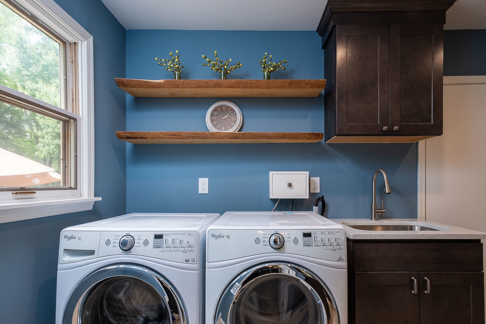 Inspiration for a small rustic utility room remodel in Philadelphia with an undermount sink, recessed-panel cabinets, brown cabinets, quartz countertops, blue walls, a side-by-side washer/dryer and multicolored countertops