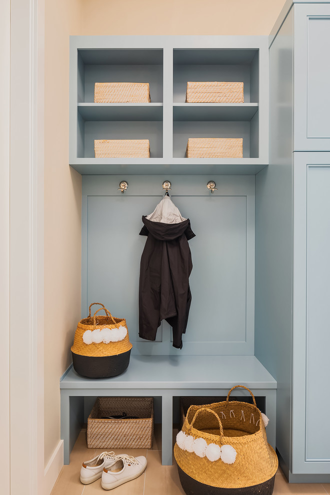Utility room - mid-sized contemporary galley medium tone wood floor utility room idea in Seattle with an undermount sink, recessed-panel cabinets, blue cabinets, quartz countertops, beige walls, a side-by-side washer/dryer and white countertops