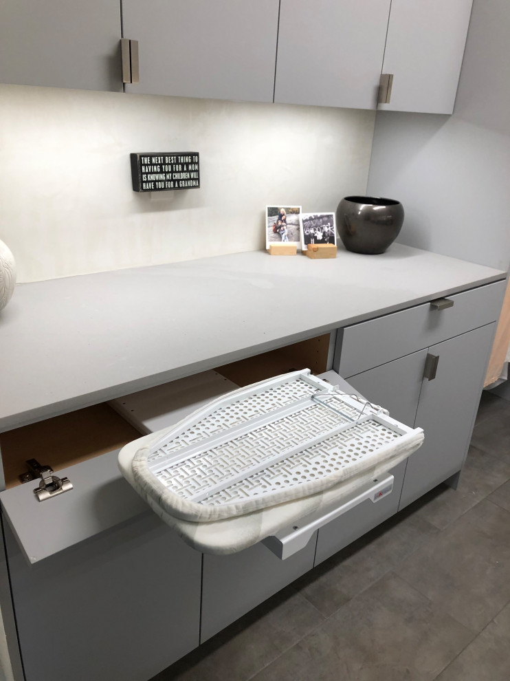 Dedicated laundry room - mid-sized contemporary galley gray floor dedicated laundry room idea in Other with an undermount sink, flat-panel cabinets, gray cabinets, beige walls, a side-by-side washer/dryer and gray countertops
