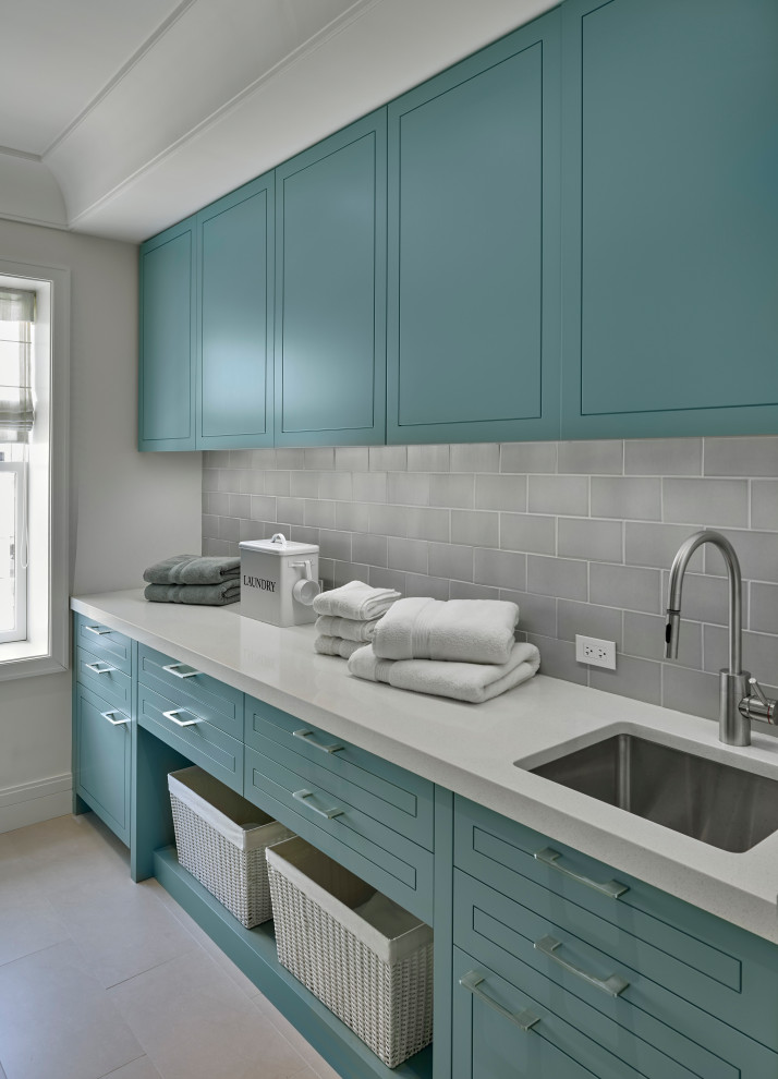 Design ideas for a medium sized traditional galley separated utility room in Chicago with a submerged sink, green cabinets, engineered stone countertops, grey splashback, cement tile splashback, white walls, porcelain flooring, beige floors, white worktops and a drop ceiling.