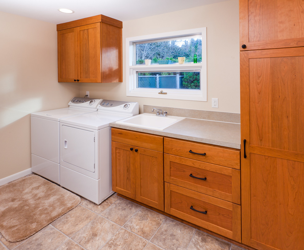 Example of a trendy laundry room design in Portland