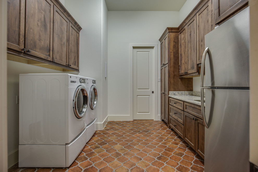 Tuscan laundry room photo in Austin