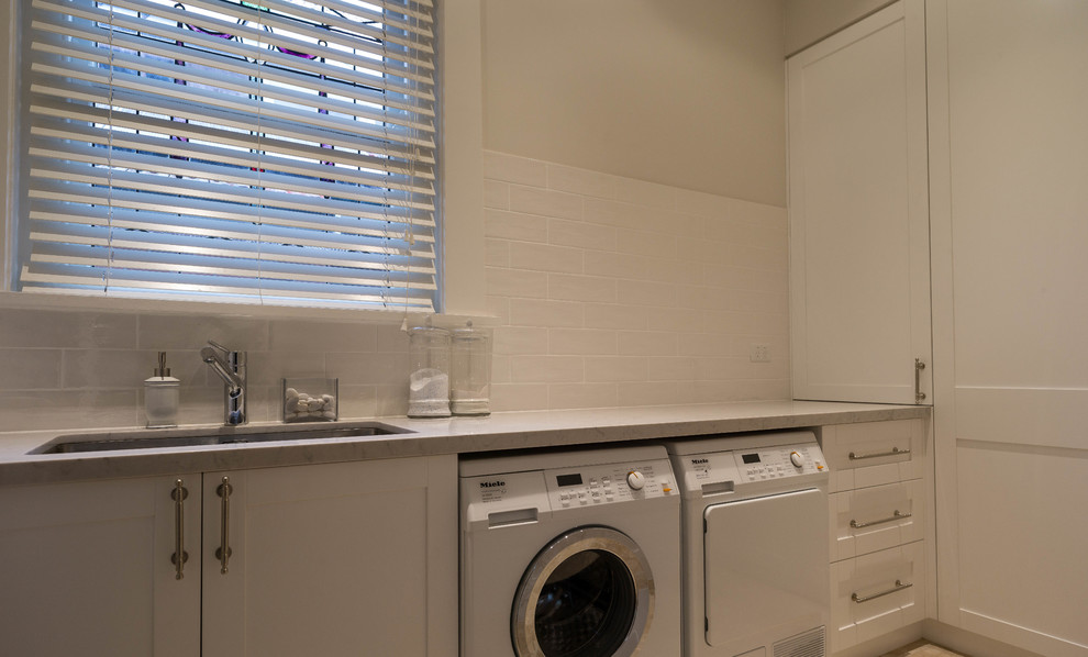 Laundry room - contemporary laundry room idea in Sydney