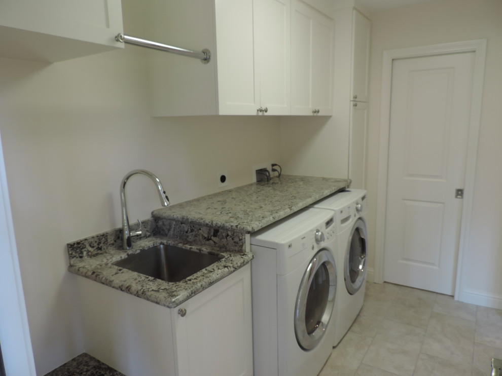 Laundry room - transitional laundry room idea in Houston with an utility sink, shaker cabinets, white cabinets and granite countertops