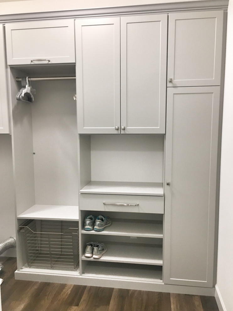 This is an example of a medium sized classic l-shaped separated utility room in St Louis with shaker cabinets and grey cabinets.