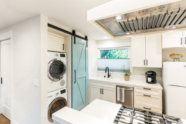 Stacked Washer and Dryer in Hidden Laundry Closet with Sliding Barn Door -  Traditional - Utility Room - Sacramento - by MAK Design + Build Inc. |  Houzz UK