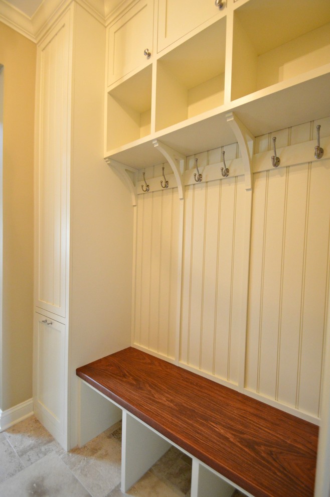 Example of a mid-sized farmhouse ceramic tile laundry room design in Philadelphia with white walls
