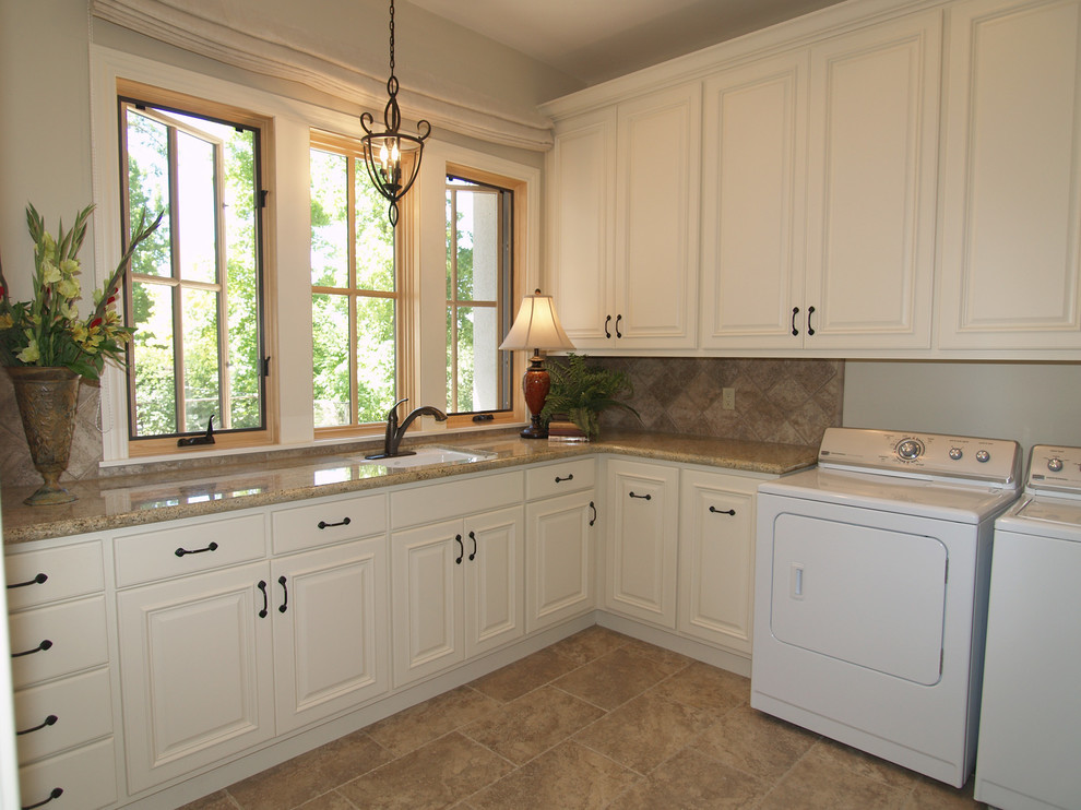 Large elegant l-shaped porcelain tile utility room photo in Sacramento with an undermount sink, raised-panel cabinets, white cabinets, granite countertops, beige walls and a side-by-side washer/dryer