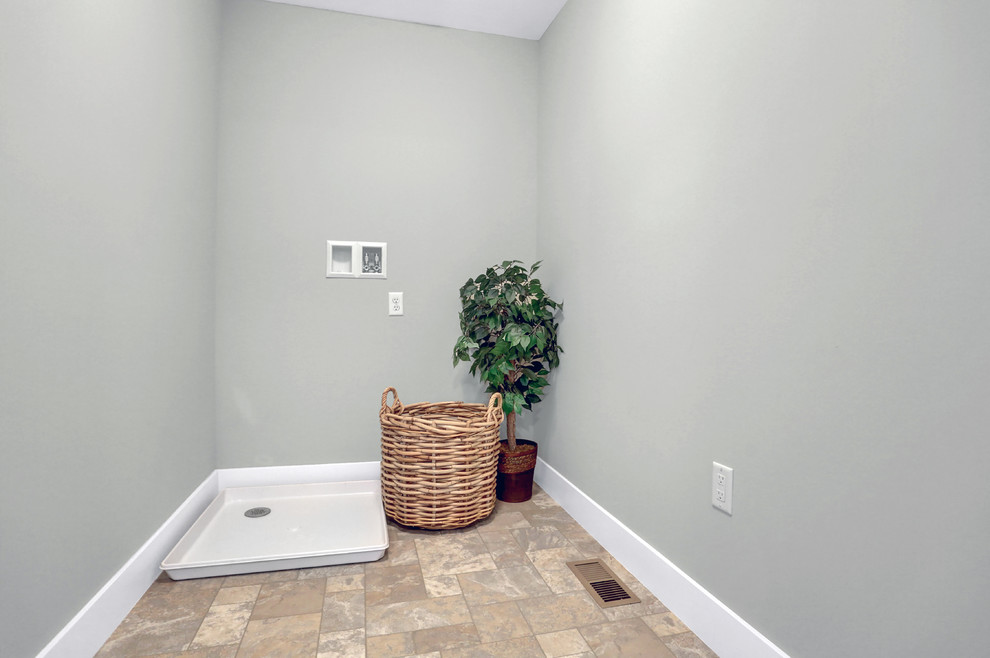 Idéer för en mellanstor klassisk tvättstuga enbart för tvätt, med grå väggar, linoleumgolv och en tvättmaskin och torktumlare bredvid varandra
