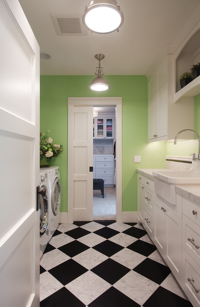 Laundry room - traditional galley marble floor and multicolored floor laundry room idea in Seattle with green walls, a farmhouse sink, shaker cabinets, white cabinets, marble countertops and a side-by-side washer/dryer