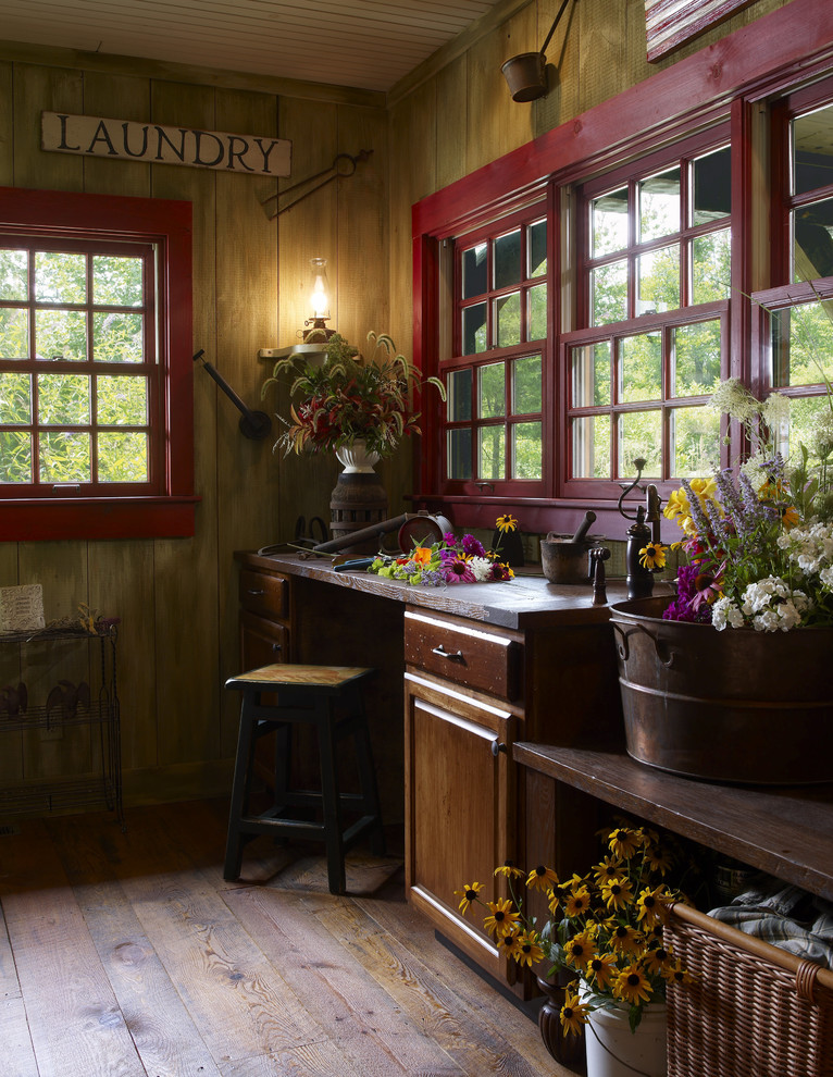 Medium sized rustic galley separated utility room in Other with dark hardwood flooring.