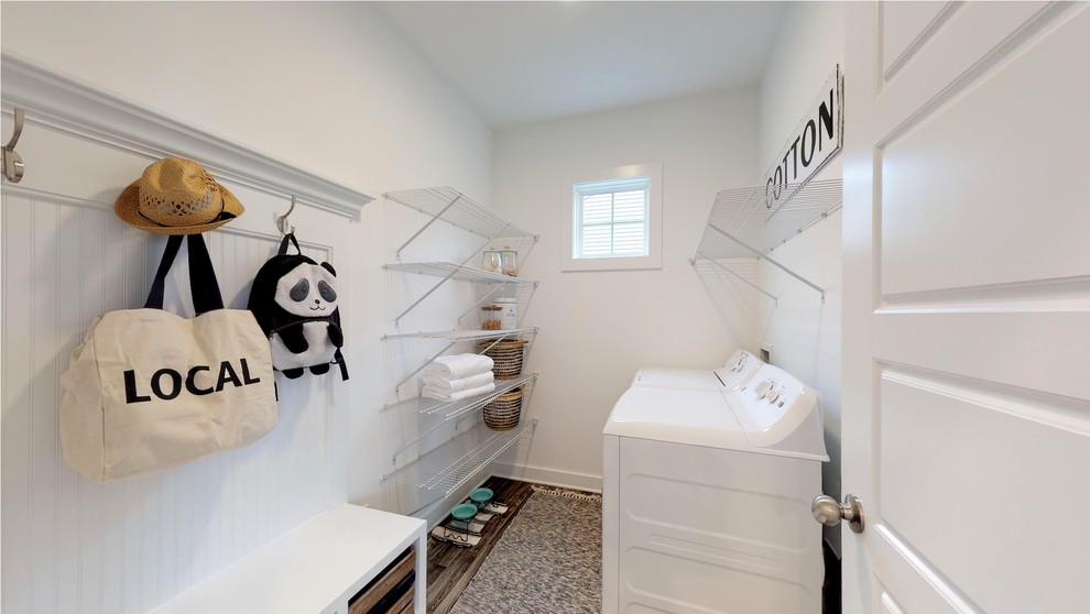 Foto di una sala lavanderia stile americano di medie dimensioni con pareti bianche, pavimento in linoleum, lavatrice e asciugatrice affiancate e pavimento grigio