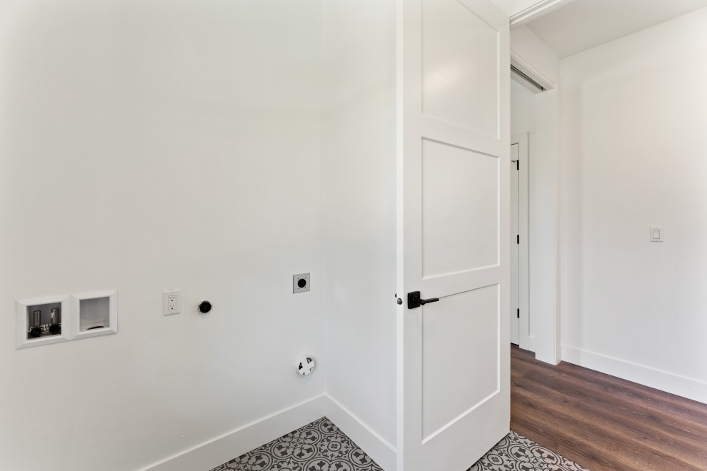 Example of a mid-sized trendy ceramic tile dedicated laundry room design in Portland with tile countertops and gray countertops