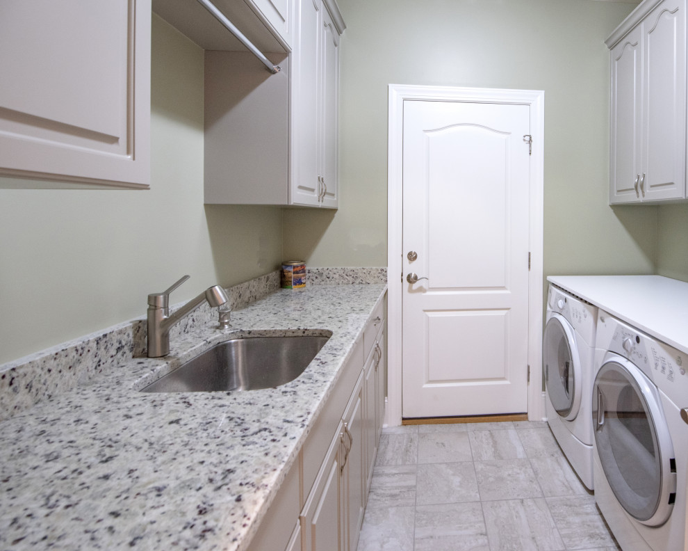 Example of an arts and crafts laundry room design in Other