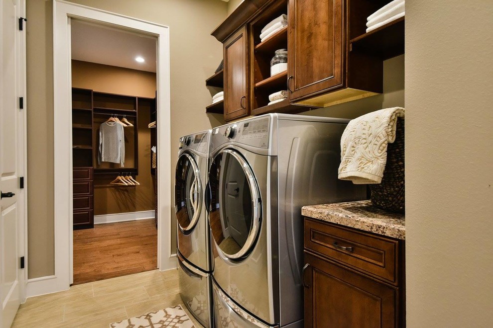 Small arts and crafts dedicated laundry room photo in Orlando with shaker cabinets, medium tone wood cabinets, laminate countertops and a side-by-side washer/dryer