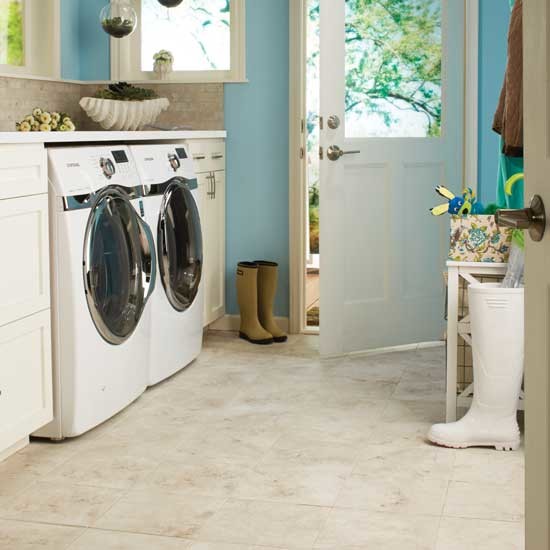 Inspiration for a medium sized coastal single-wall utility room in Oklahoma City with shaker cabinets, blue walls, ceramic flooring and a side by side washer and dryer.