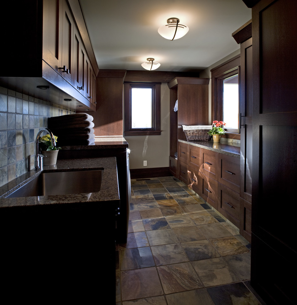 Inspiration for a medium sized traditional u-shaped separated utility room in Calgary with a submerged sink, shaker cabinets, medium wood cabinets, beige walls and a side by side washer and dryer.