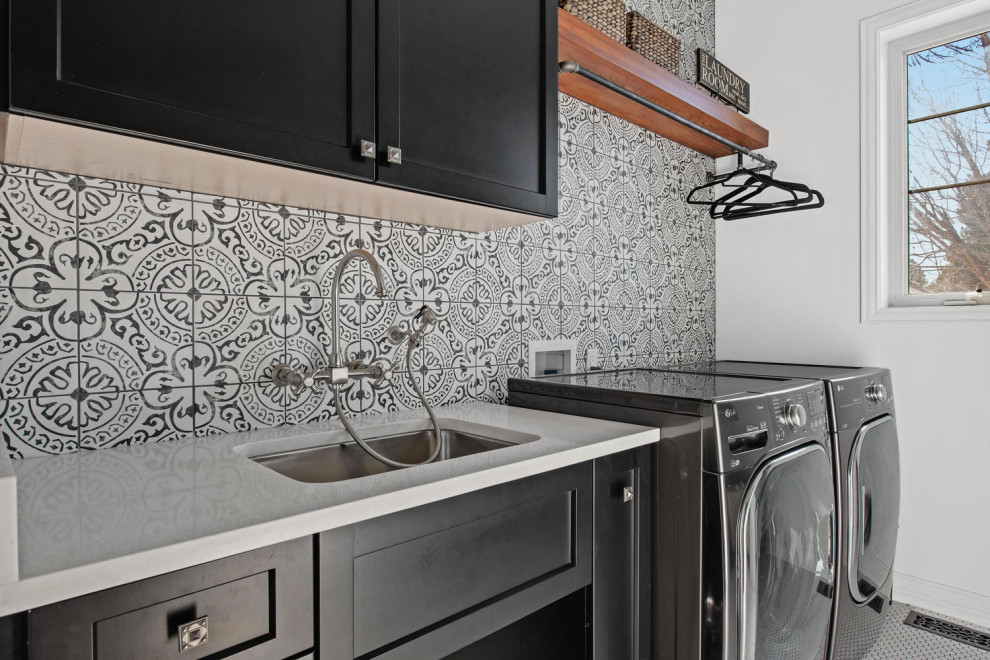 Example of a small trendy porcelain tile laundry room design in Denver with an undermount sink, flat-panel cabinets, black cabinets, quartz countertops, multicolored walls and white countertops