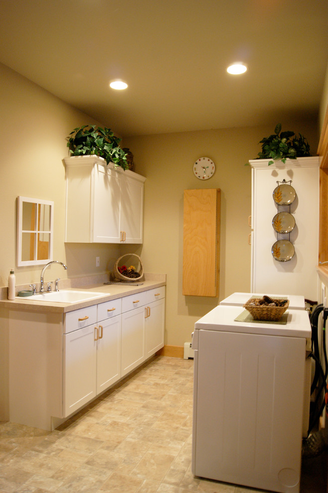 Example of a mountain style laundry room design in Denver