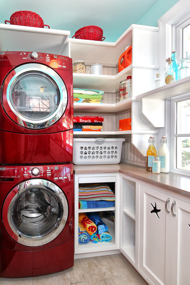 Inspiration for a timeless laundry room remodel in Philadelphia with a stacked washer/dryer