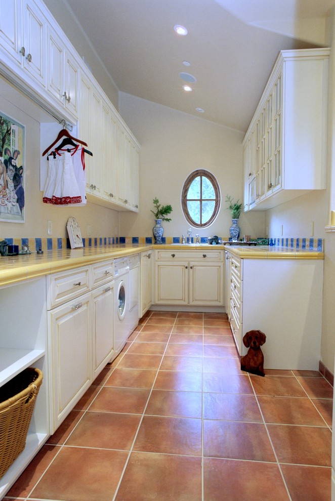 Elegant terra-cotta tile laundry room photo in San Francisco with yellow countertops
