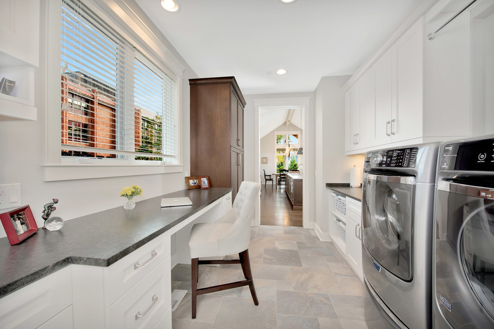 Inspiration for a medium sized classic galley utility room in Chicago with a submerged sink, recessed-panel cabinets, white cabinets, granite worktops, grey walls, dark hardwood flooring and a side by side washer and dryer.