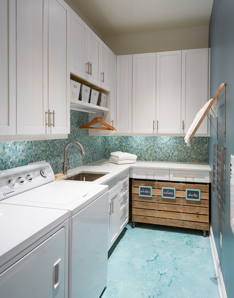 Inspiration for a small nautical l-shaped separated utility room in Jacksonville with a submerged sink, shaker cabinets, white cabinets, engineered stone countertops, concrete flooring, a side by side washer and dryer, turquoise floors and blue walls.