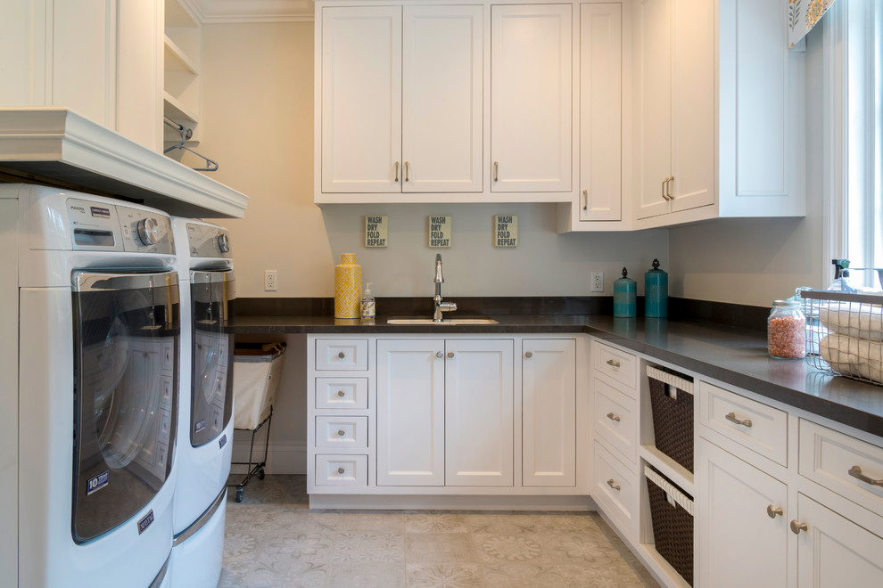 Mid-sized trendy galley marble floor utility room photo in Los Angeles with an undermount sink, flat-panel cabinets, white cabinets, granite countertops, beige walls and a side-by-side washer/dryer