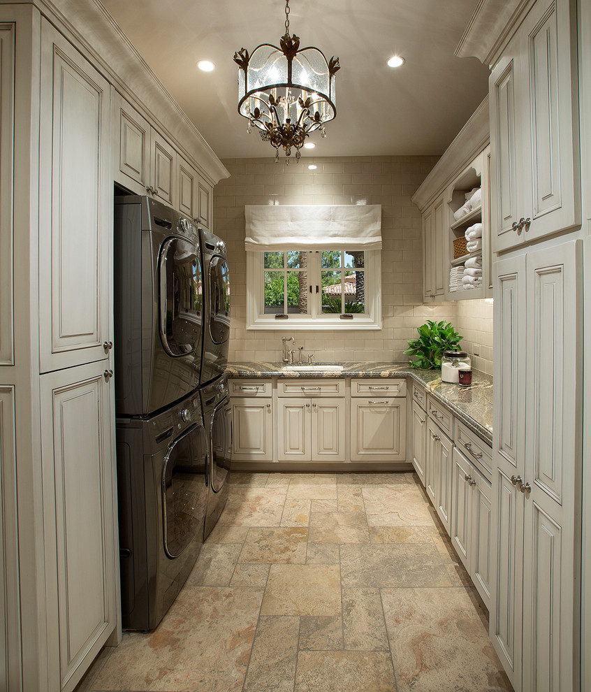 Dedicated laundry room - large u-shaped ceramic tile dedicated laundry room idea in Phoenix with raised-panel cabinets, white cabinets, granite countertops, beige walls, a side-by-side washer/dryer and an undermount sink
