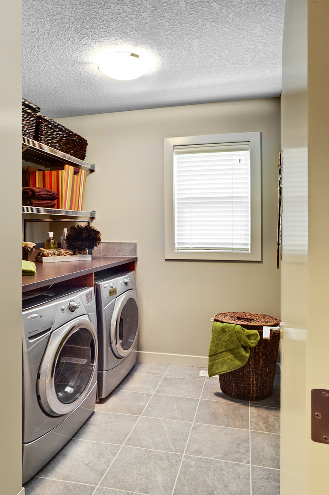 Inspiration for a contemporary laundry room remodel in Edmonton