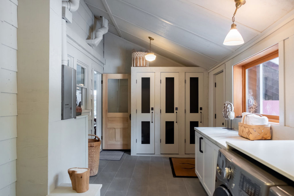 Inspiration for a mid-sized timeless galley slate floor and gray floor utility room remodel in Sacramento with shaker cabinets, beige cabinets, quartzite countertops, gray walls, a side-by-side washer/dryer and white countertops