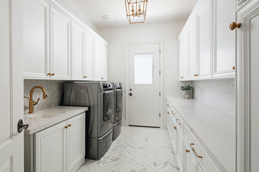 Design ideas for a large traditional galley separated utility room in Phoenix with a submerged sink, raised-panel cabinets, white cabinets, engineered stone countertops, white walls, marble flooring, a side by side washer and dryer, white floors and white worktops.