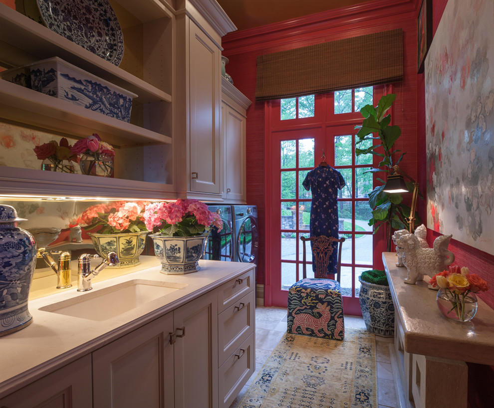 Example of a mid-sized classic galley limestone floor utility room design in Atlanta with white cabinets, quartz countertops, a side-by-side washer/dryer, an undermount sink, red walls and recessed-panel cabinets