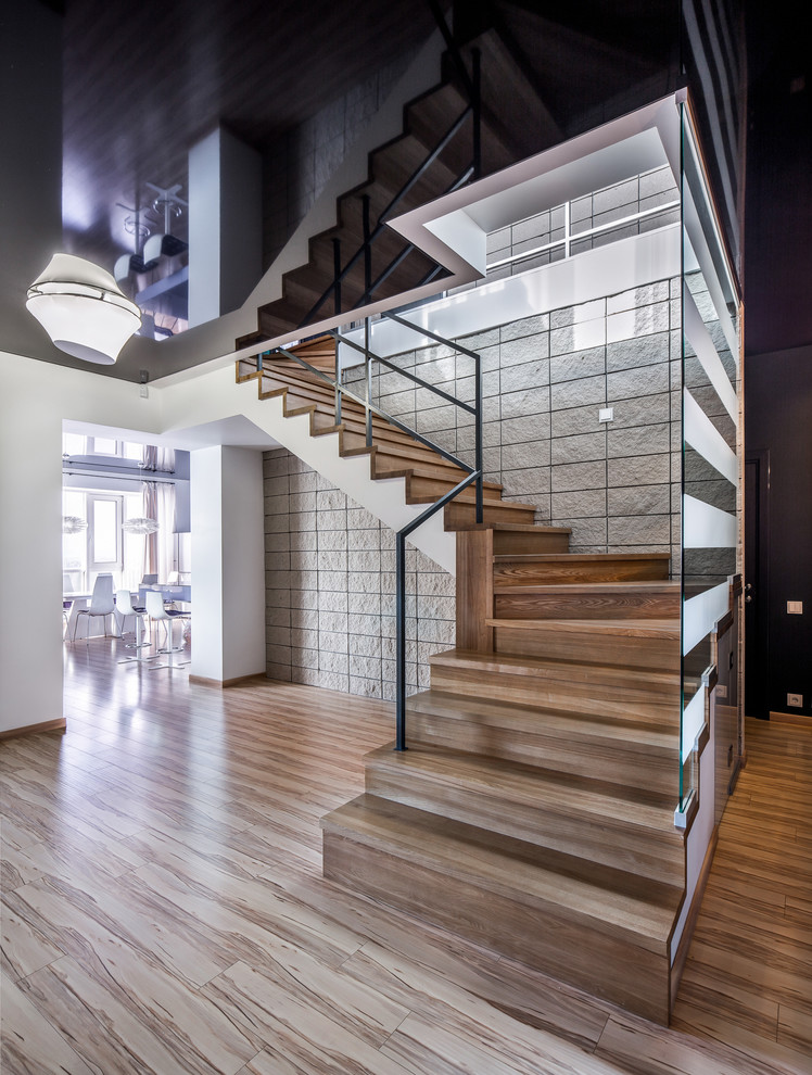 Design ideas for a contemporary l-shaped staircase in Other with wood risers.
