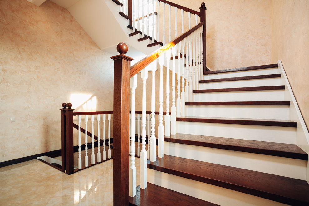 Design ideas for a large traditional wood wood railing staircase in Other with wood risers.