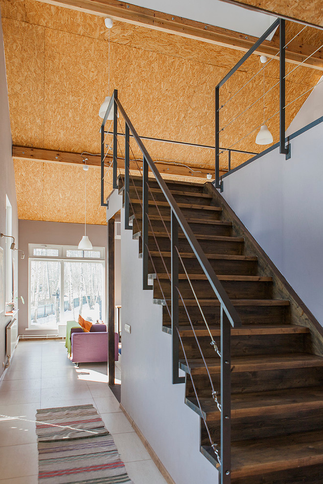 Inspiration for a contemporary wood straight staircase in Moscow with wood risers.