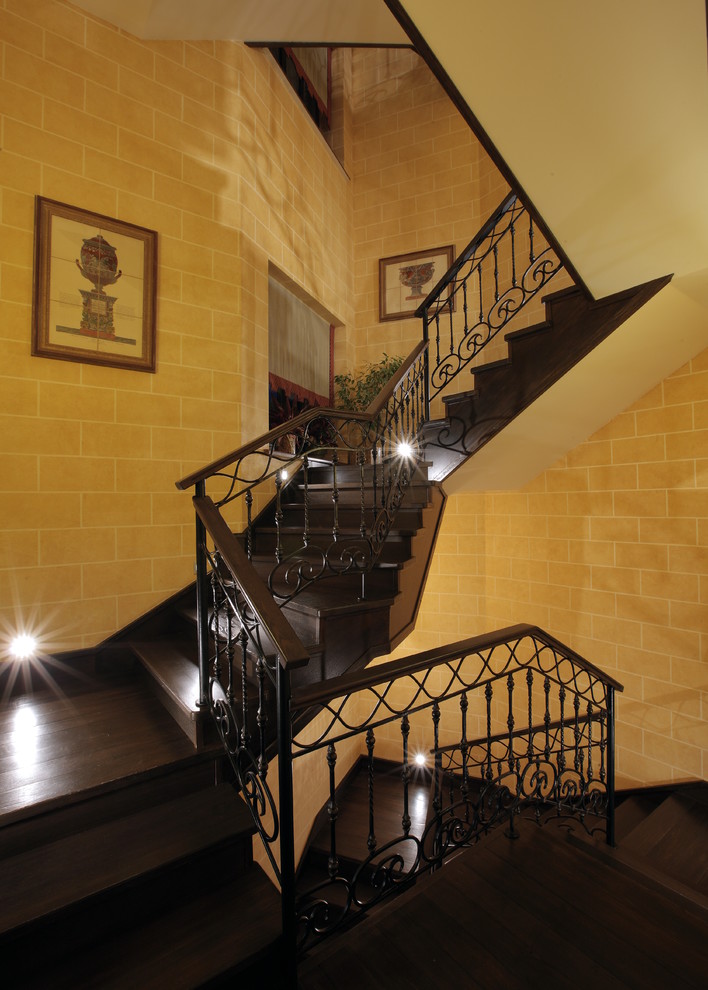 This is an example of a mediterranean wood l-shaped staircase in Moscow with wood risers.