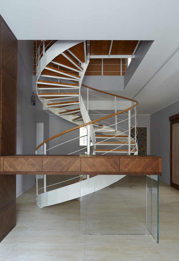 Inspiration for a mid-sized contemporary wooden spiral open staircase remodel in Moscow