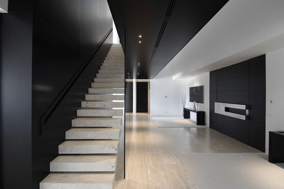 This is an example of a medium sized modern concrete floating staircase in Other with open risers.