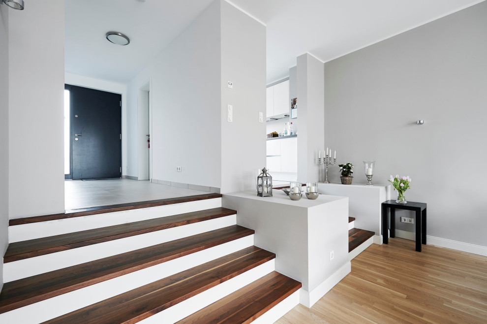Inspiration for a contemporary wooden straight staircase remodel in Moscow