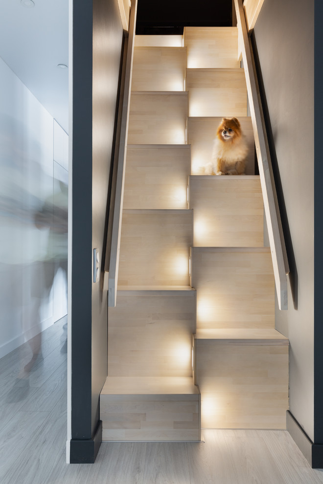 Inspiration for a scandinavian wooden straight staircase remodel in Other with wooden risers