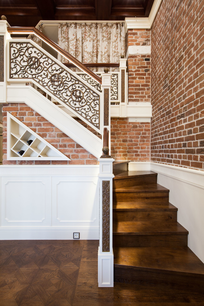 Стильный дизайн: угловая деревянная лестница среднего размера в стиле лофт с деревянными ступенями и деревянными перилами - последний тренд