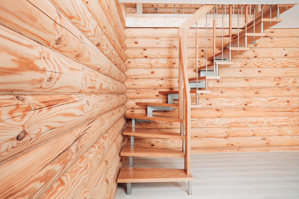 Aménagement d'un escalier en L de taille moyenne avec des marches en bois.