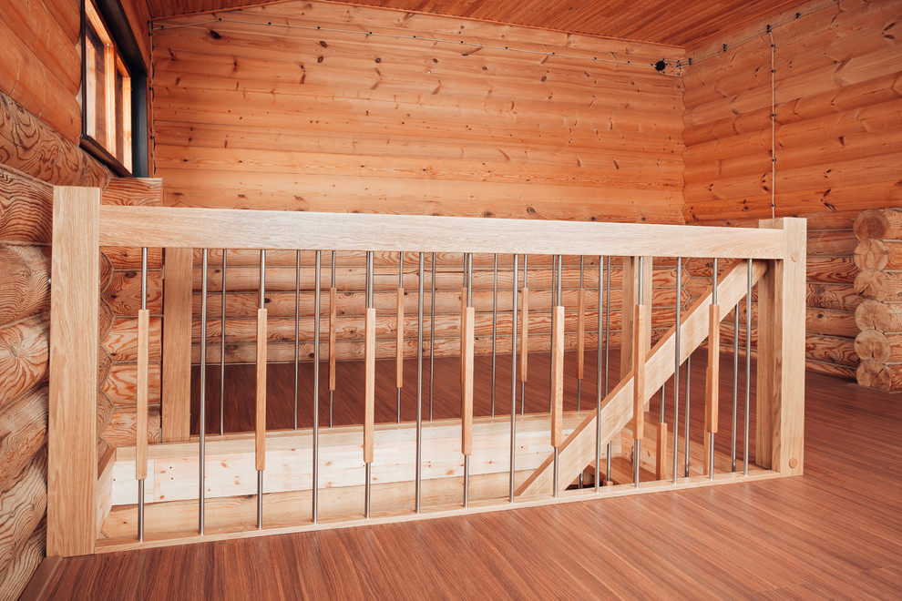 Cette photo montre un escalier tendance en L de taille moyenne avec des marches en bois.