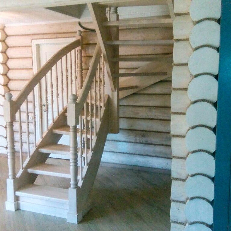 Photo of a traditional wood u-shaped wood railing staircase in Moscow.