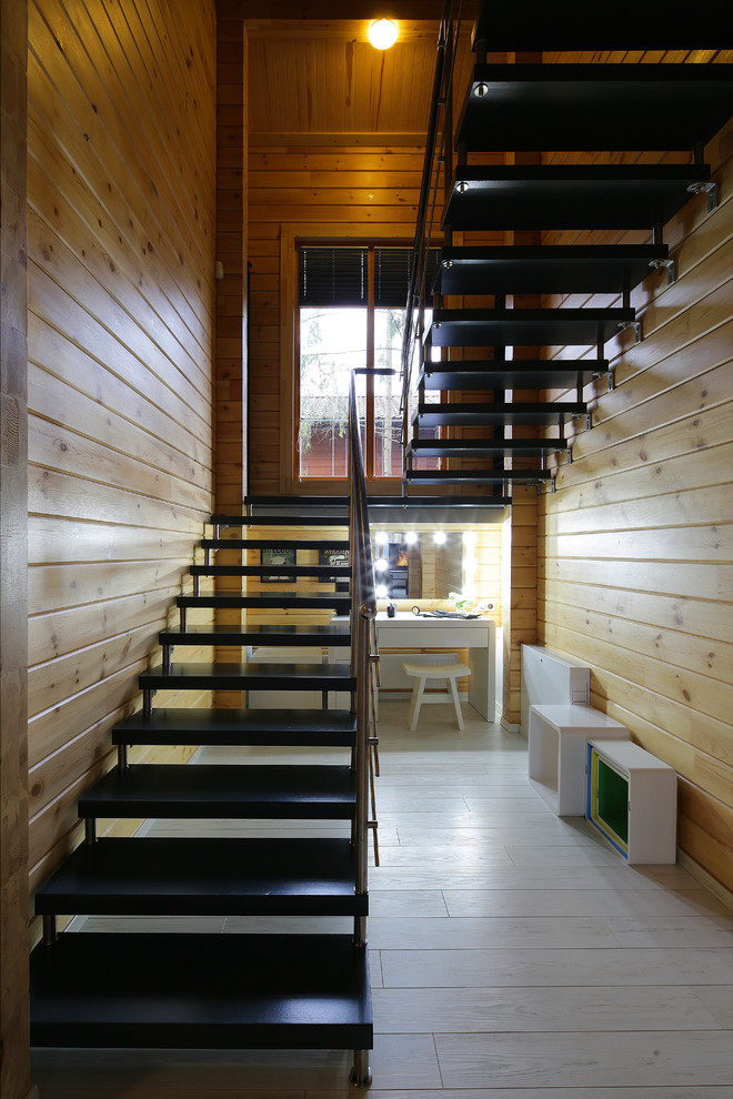 Идея дизайна: п-образная лестница среднего размера в современном стиле с деревянными ступенями и металлическими перилами
